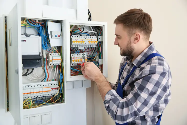 Local electrician repairing an electrical panel in Wolverhampton
