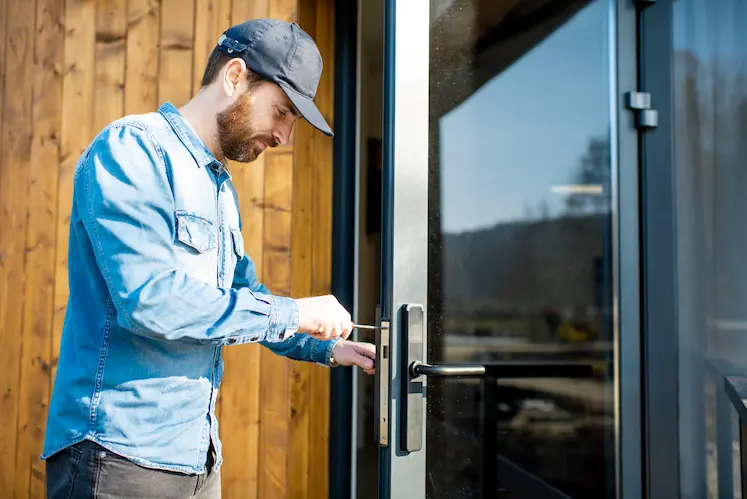 Local locksmith fitting a new lock in a Dudley property