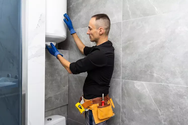 Local plumber installing a water heater in Coventry