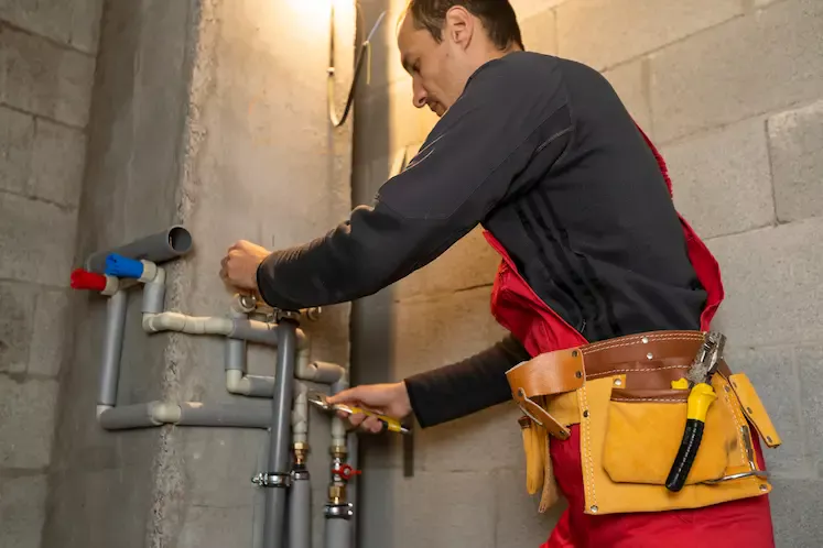 Local plumber fitting pipework at a North East property