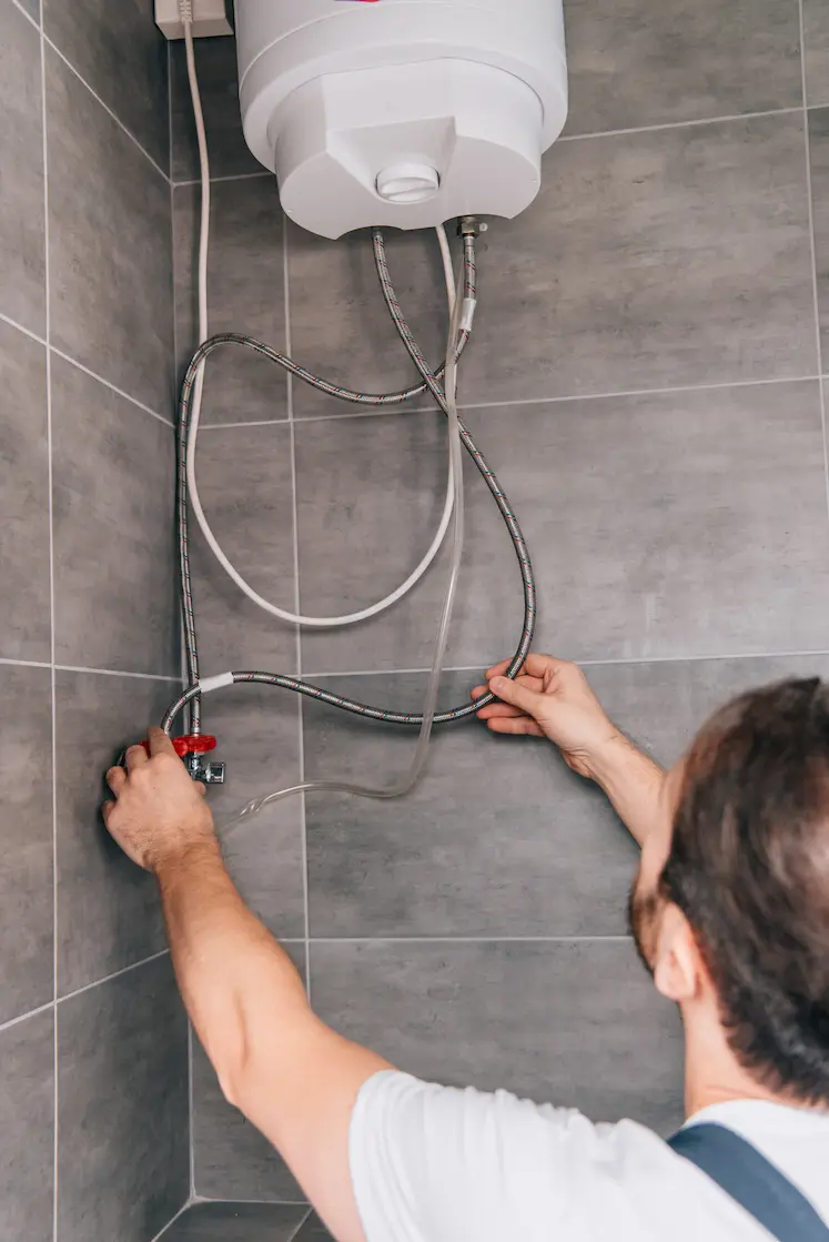 Electrician repairing an electrical panel